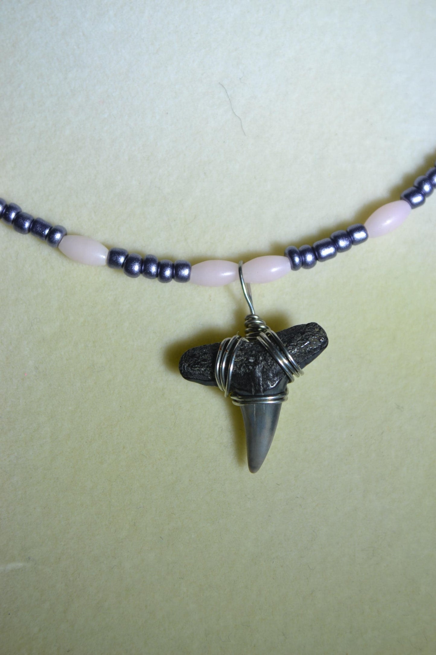 Wire wrapped sharks tooth beaded necklace. Pink and gunmetal