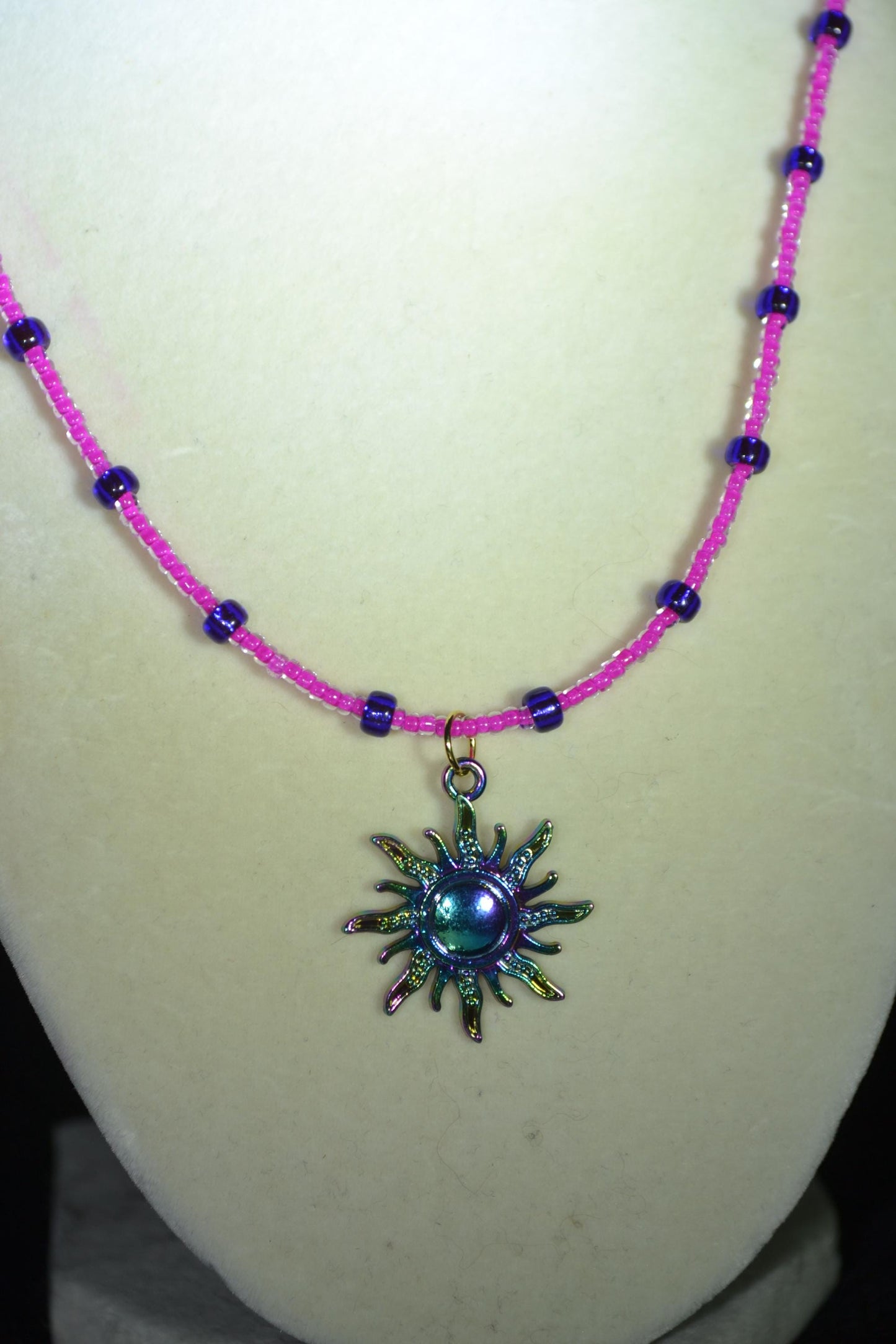 Rainbow sun pendant glass bead necklace. Pink and purple