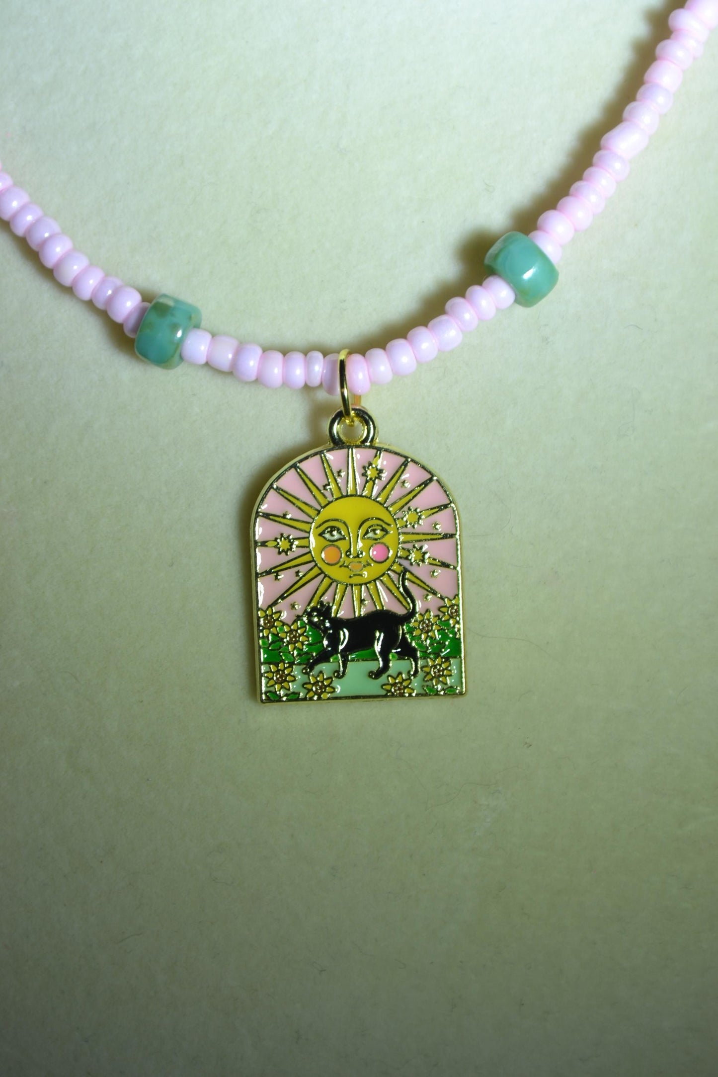 Black cat with sun pendant glass bead necklace