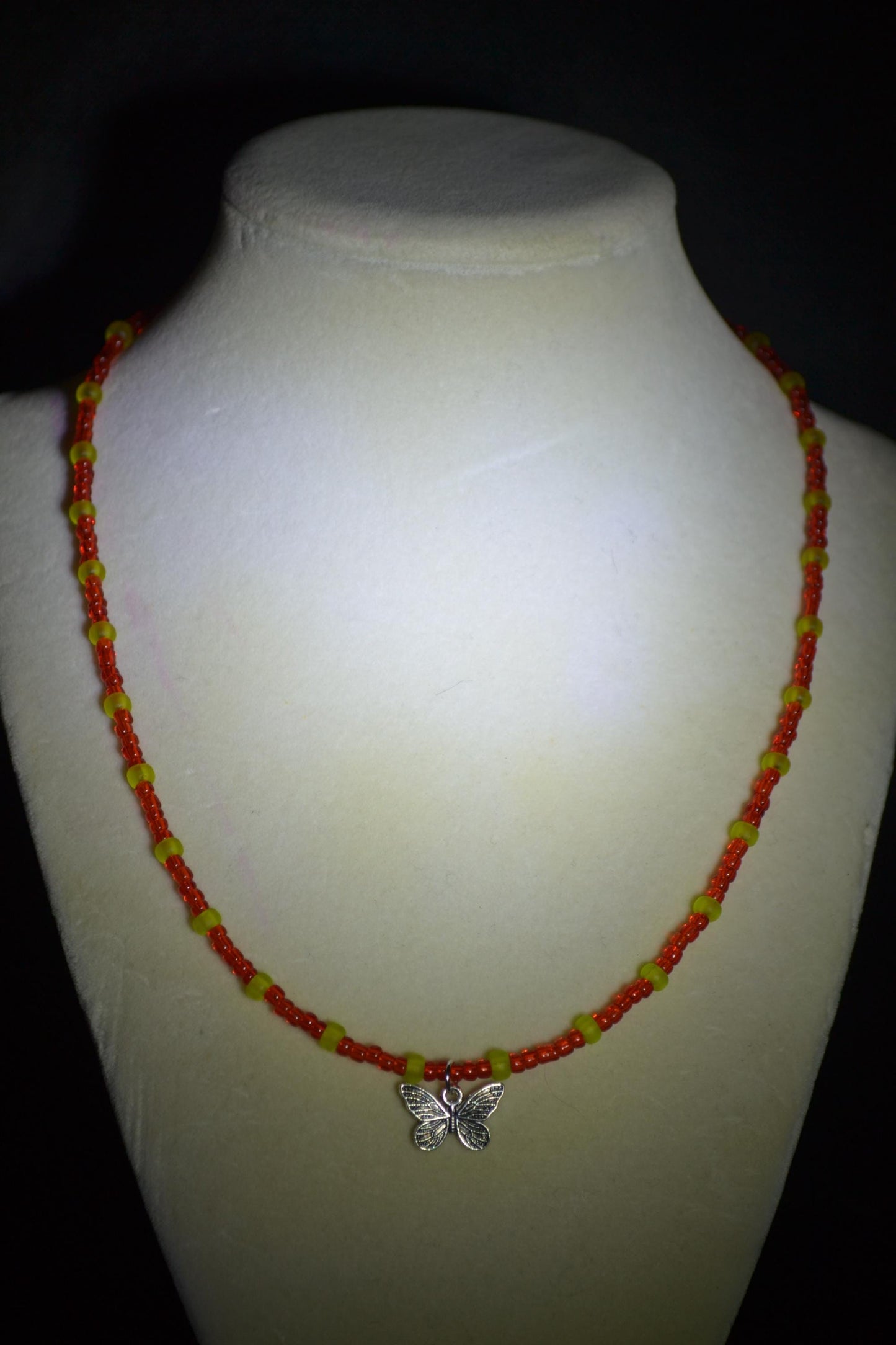 Butterfly pendant glass bead necklace. Red and green