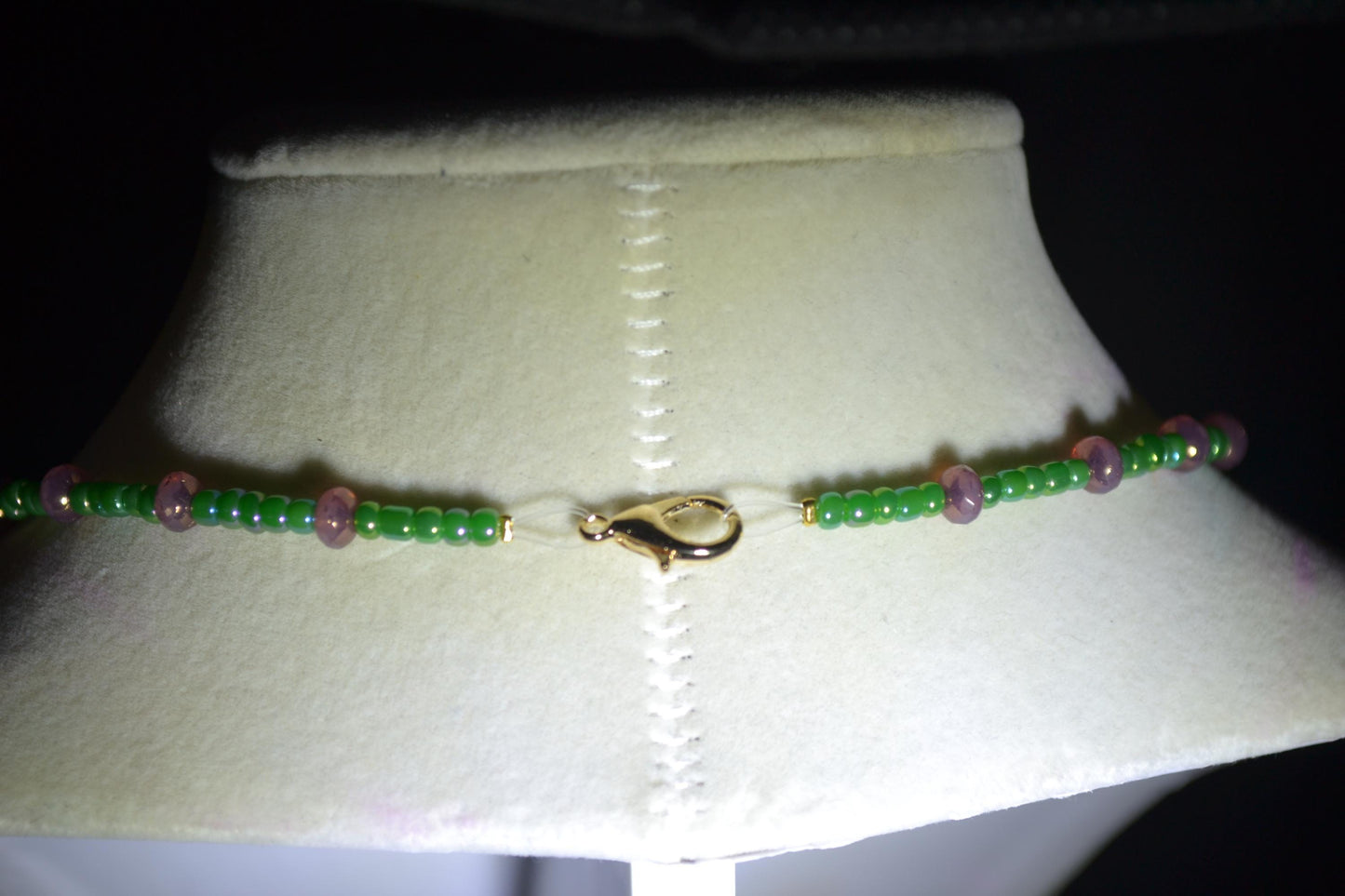Green moon pendant glass bead necklace. Purple and green