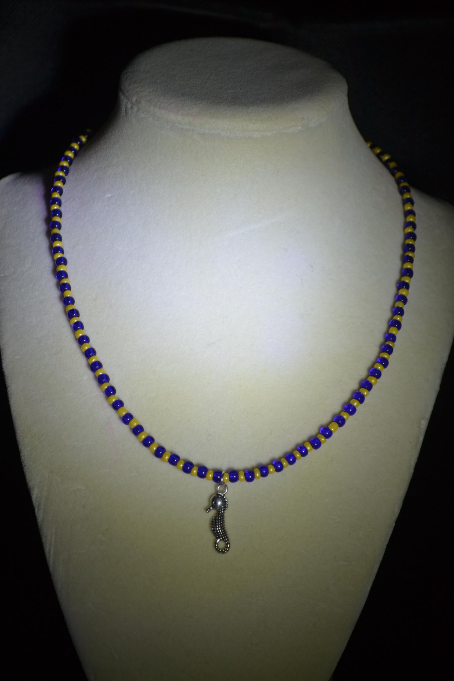 Seahorse pendant glass bead necklace. Blue and yellow