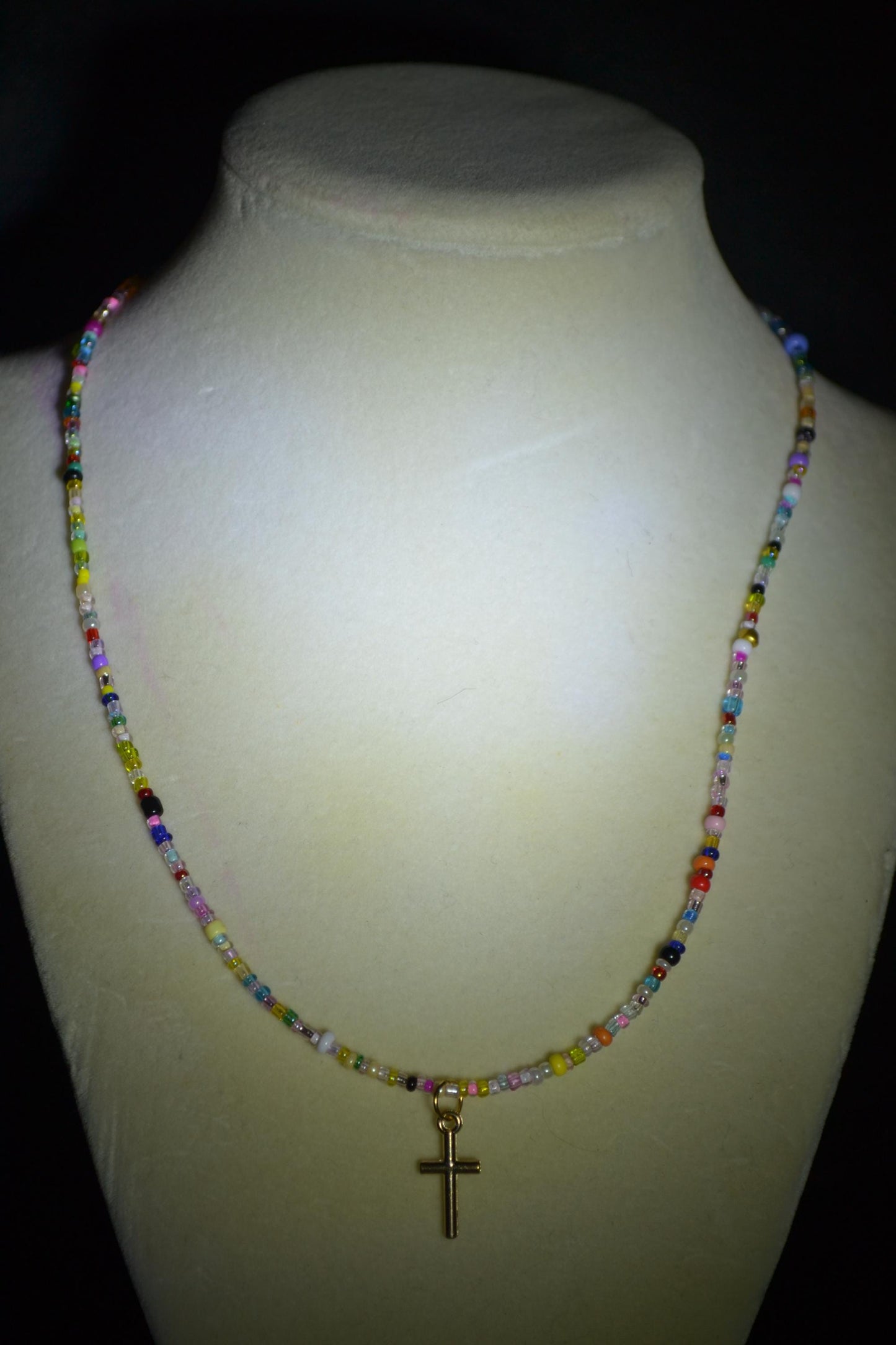 Cross pendant glass bead necklace. Rainbow