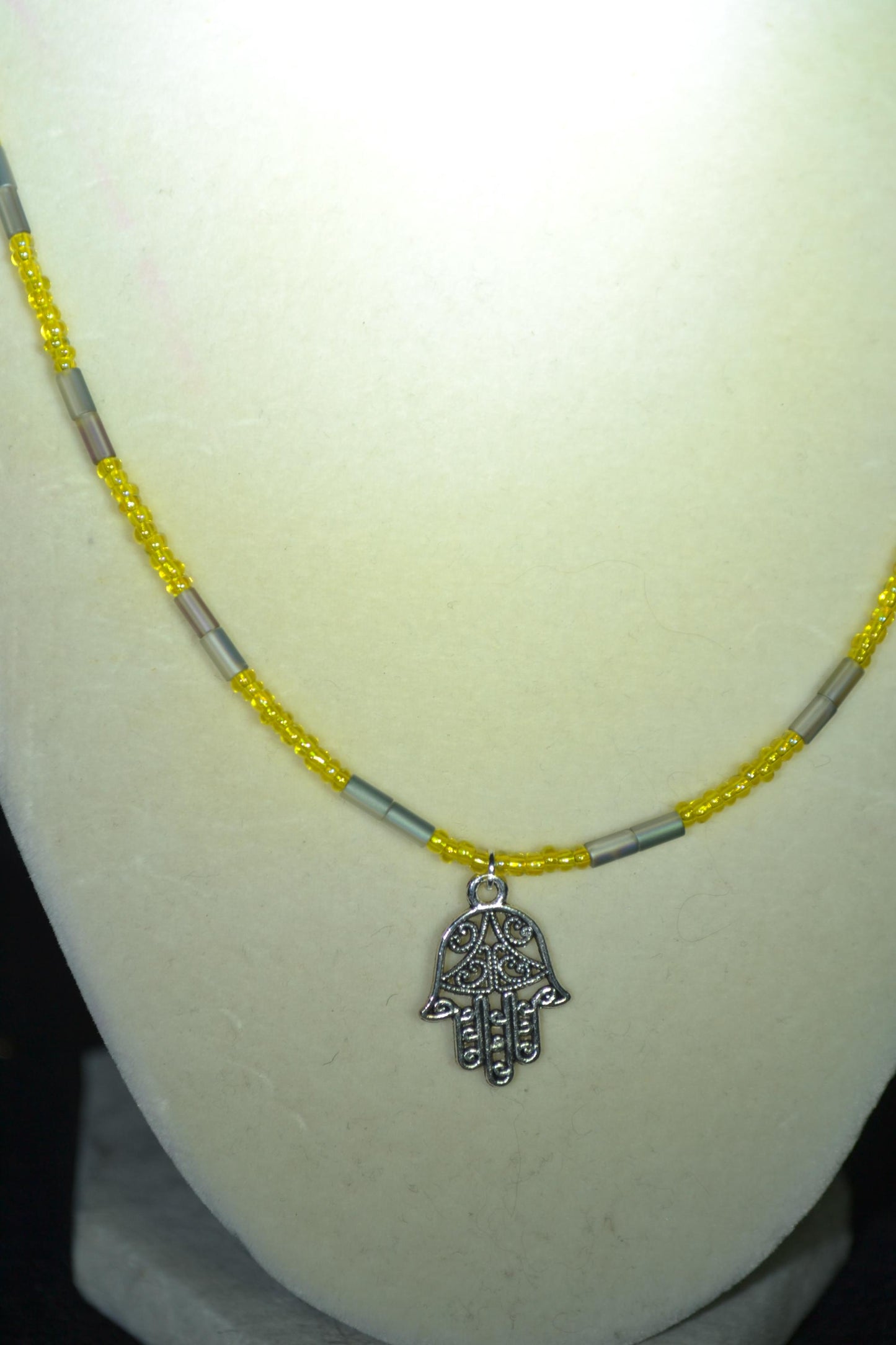 Hamsa pendant glass bead necklace. Yellow and silver