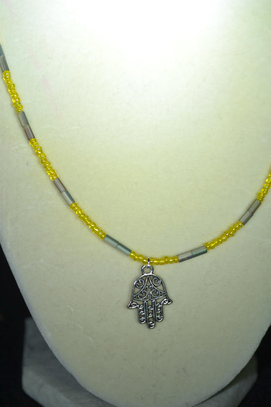 Hamsa pendant glass bead necklace. Yellow and silver