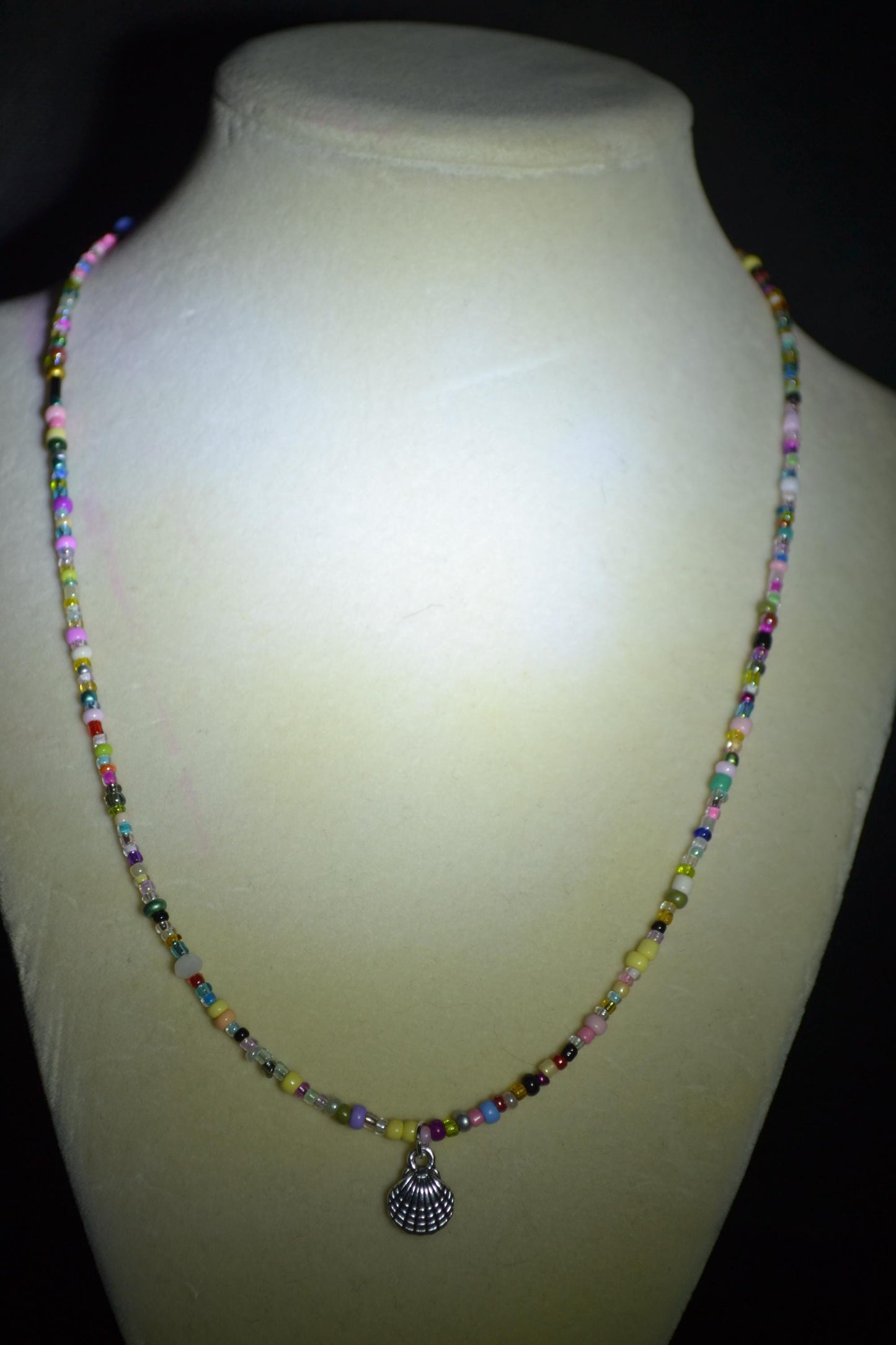 Seashell pendant glass bead necklace. Rainbow