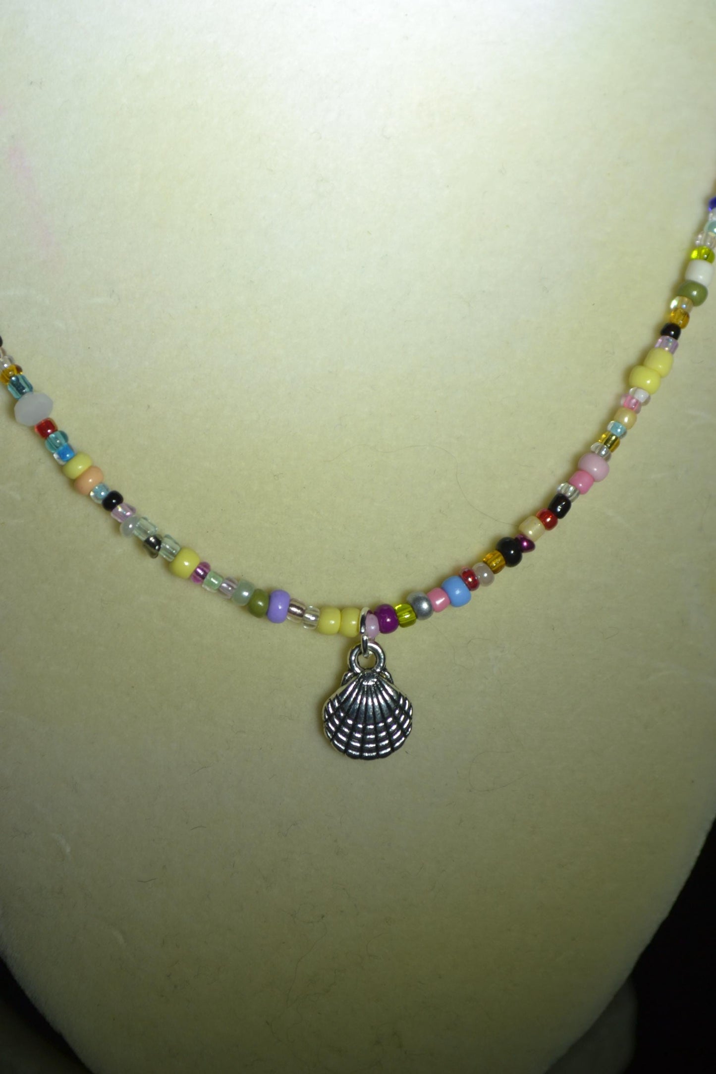 Seashell pendant glass bead necklace. Rainbow