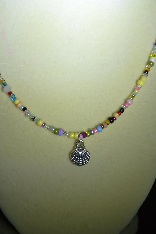 Seashell pendant glass bead necklace. Rainbow