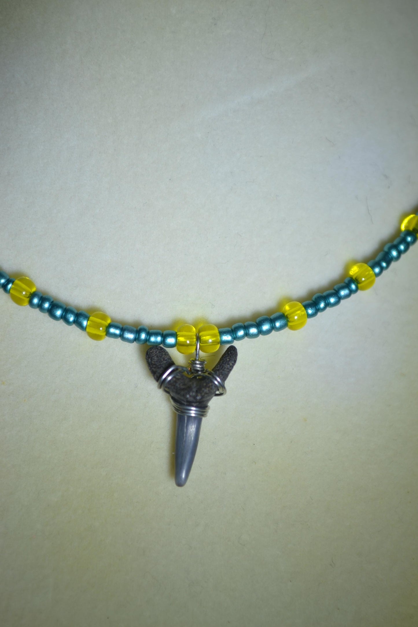 Wire wrapped sharks tooth beaded choker. Metallic blue and yellow