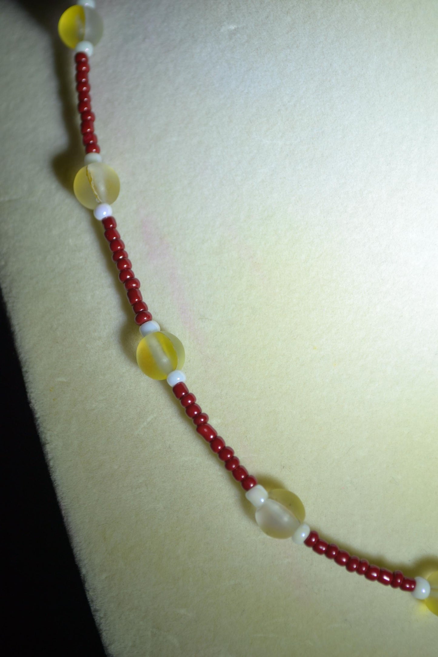 Multicolor glass bead necklace. Red, yellow, and white.