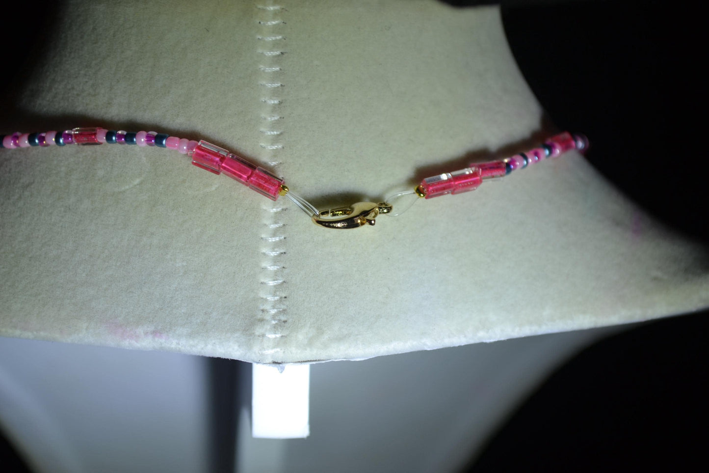 Skull and bones pendant glass bead choker. Pink and blue