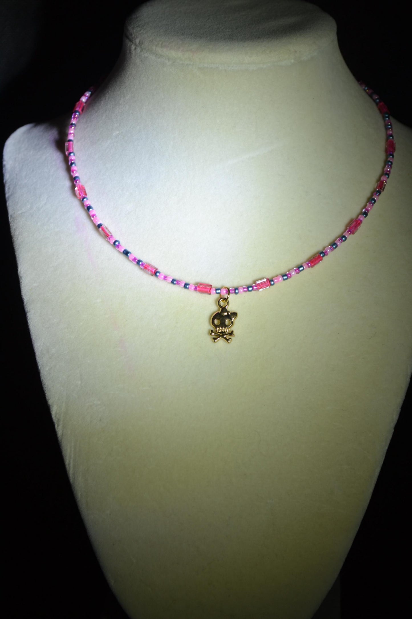 Skull and bones pendant glass bead choker. Pink and blue