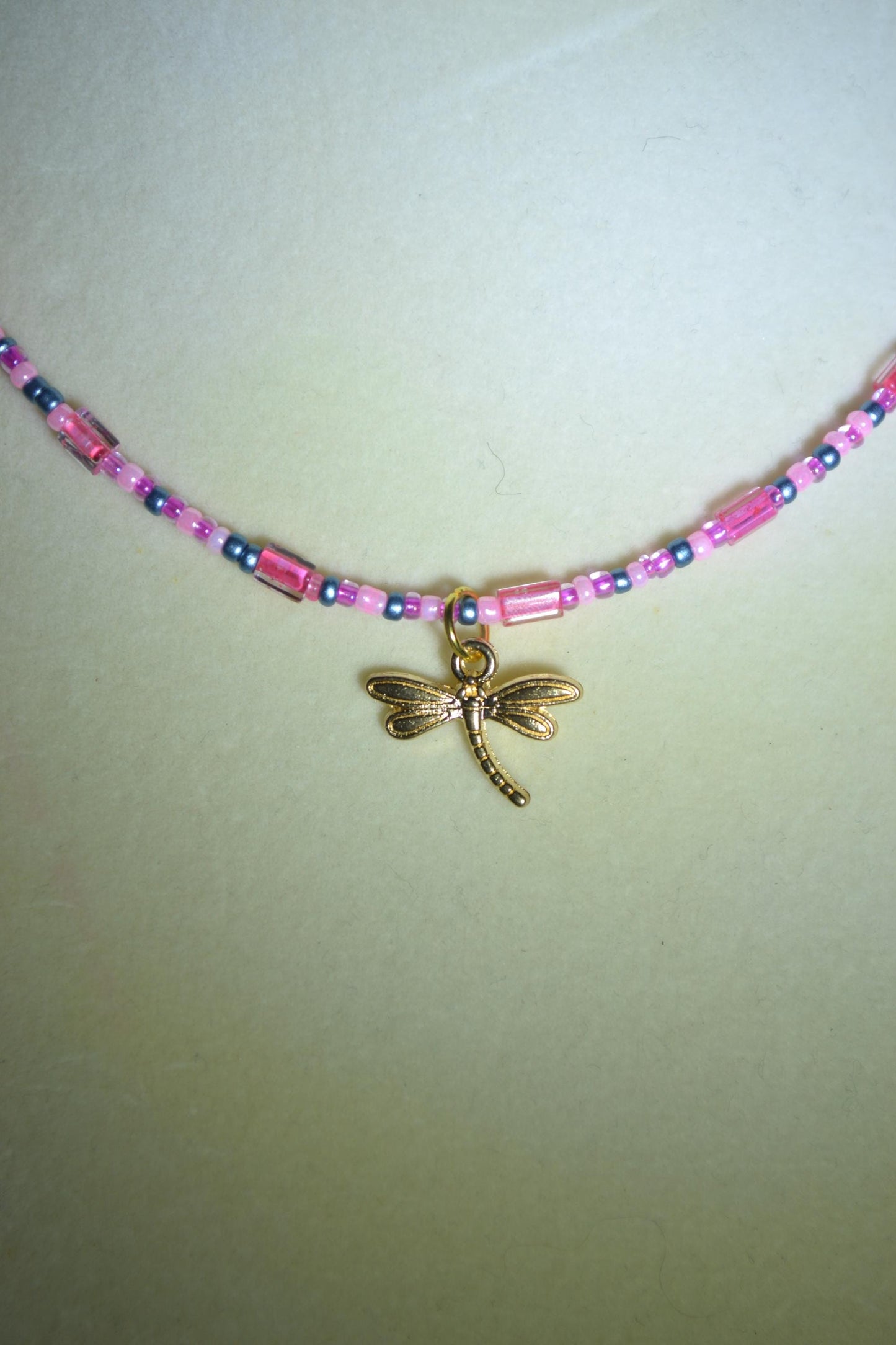 Gold dragonfly pendant glass bead choker. Pink and blue