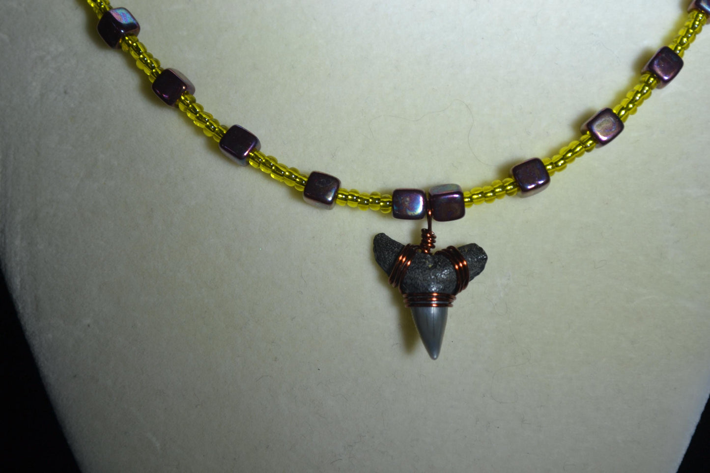 Wire wrapped sharks tooth beaded necklace. Yellow and gunmetal