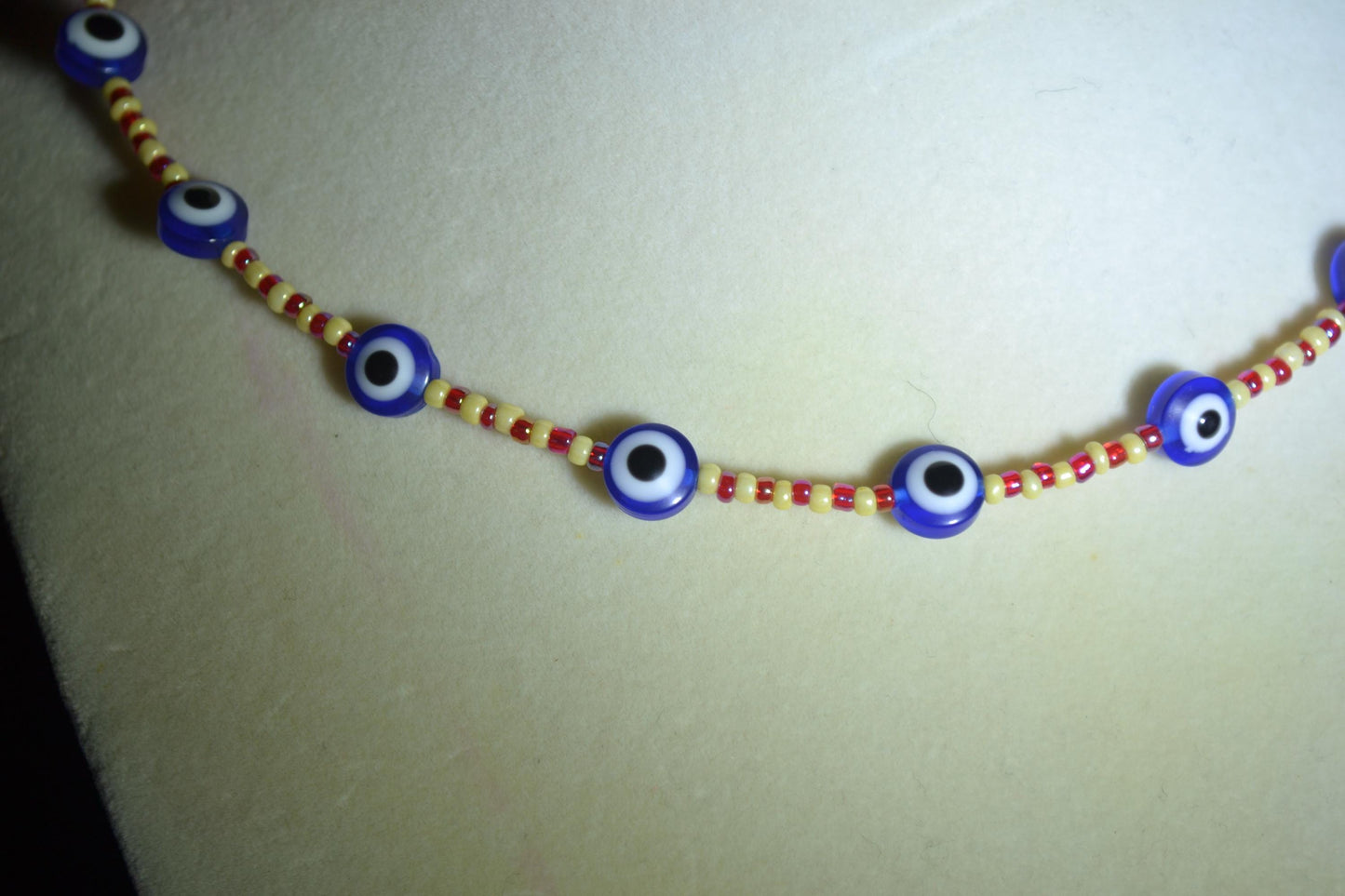 Multicolor glass bead necklace. Evil eye, red, yellow
