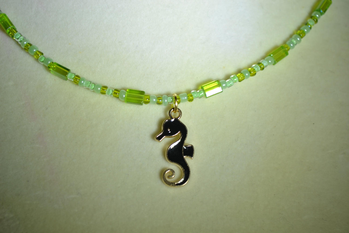 Black seahorse pendant glass bead choker. Greens