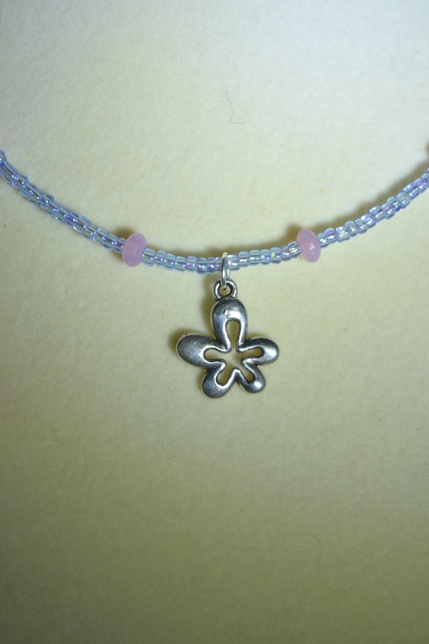 Silver flower pendant glass bead necklace. Pink and blue