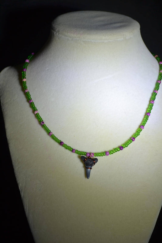 Wire wrapped sharks tooth beaded necklace. Purple and green