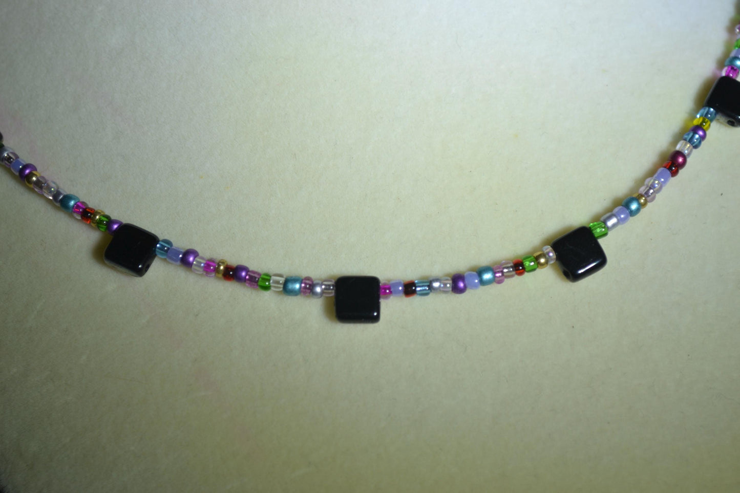 Multicolor glass bead necklace. Reversible rainbow and iridescent black