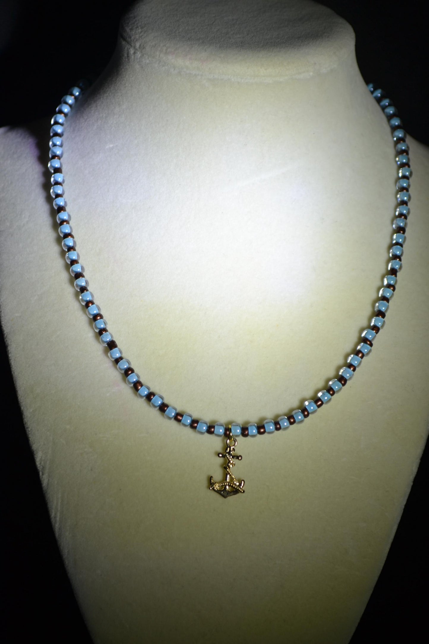 Anchor pendant glass bead necklace. Blue and brown