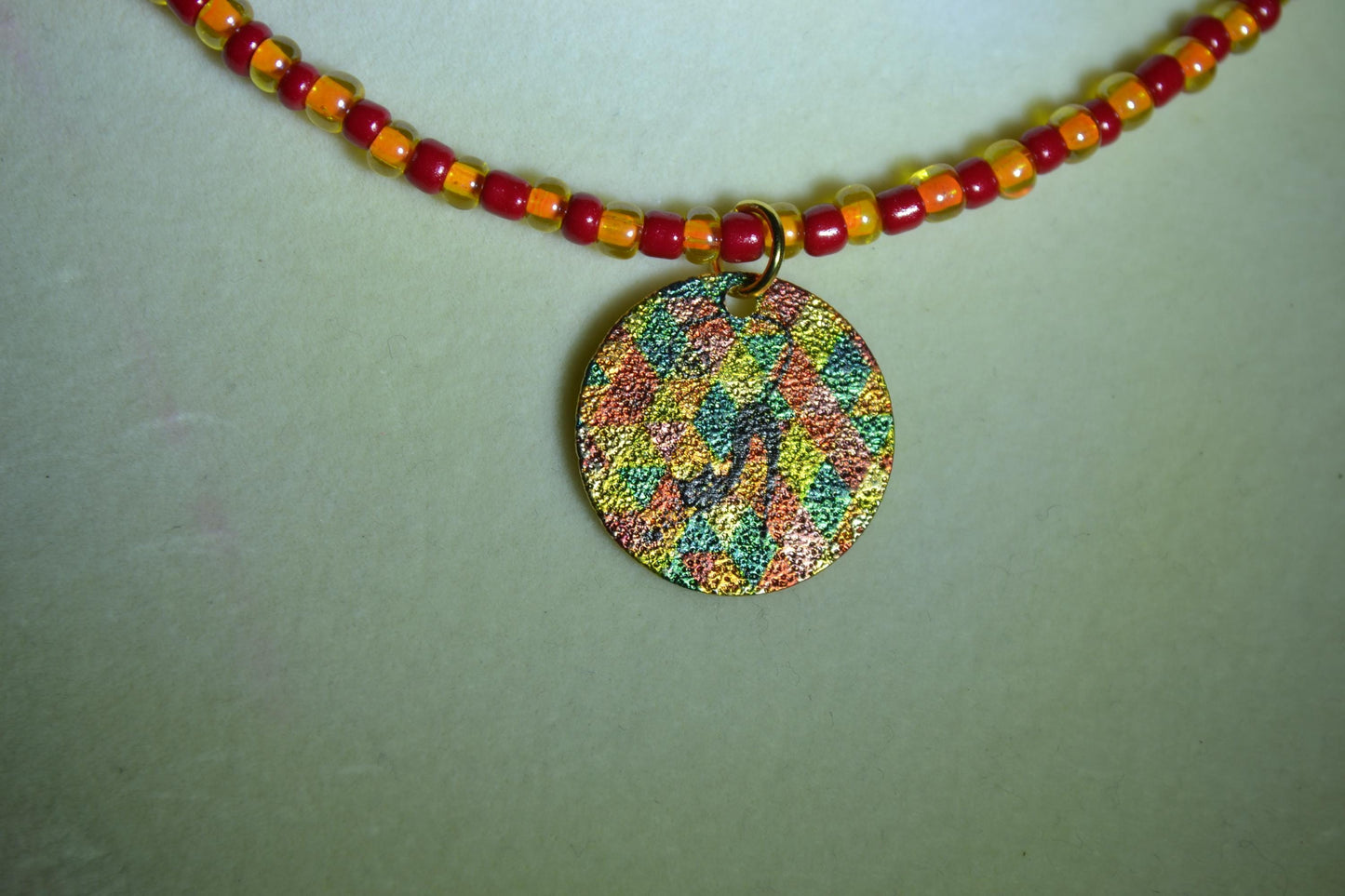 Vintage black cat pendant glass bead choker. Red and orange