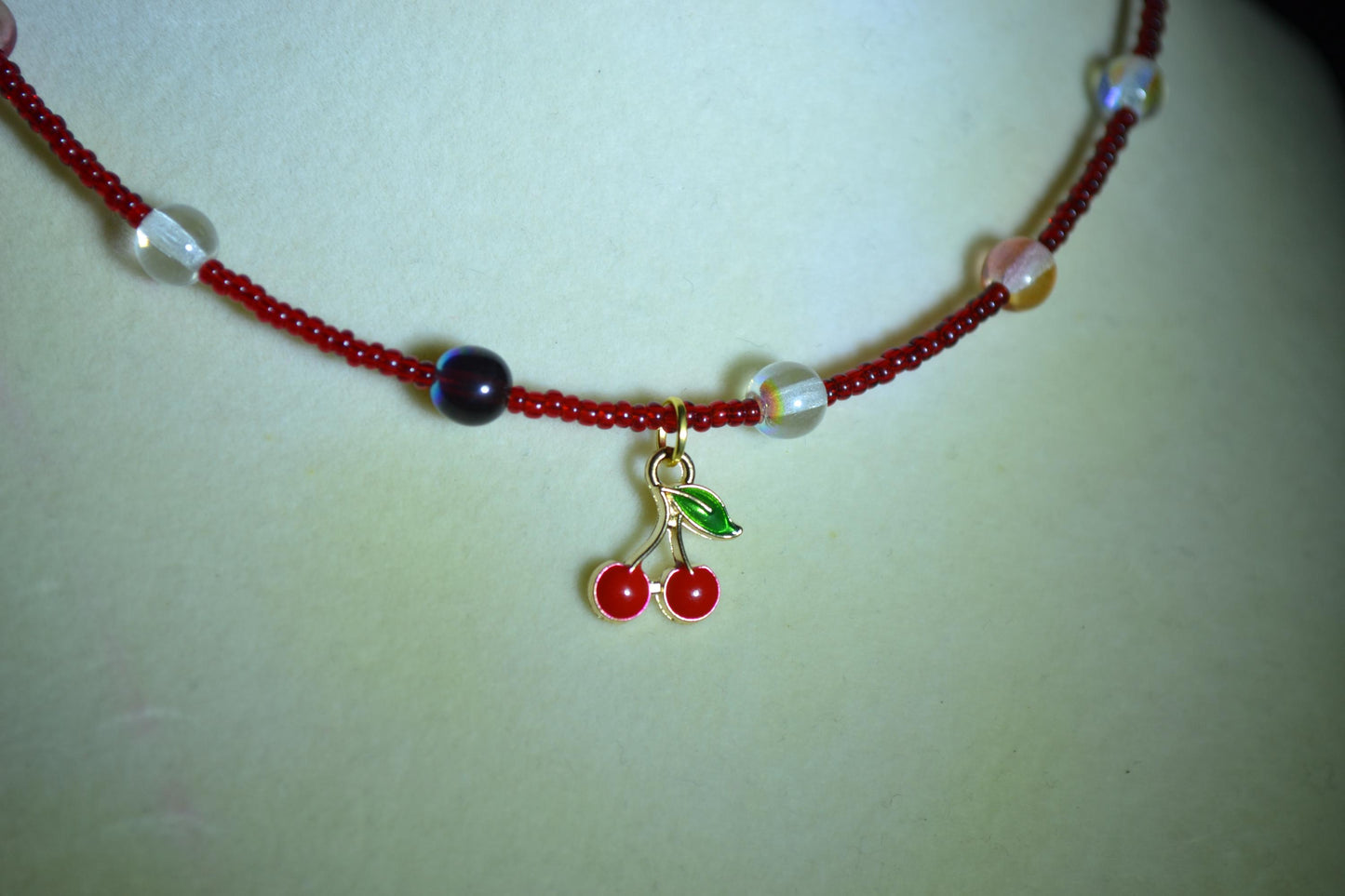 Cherry pendant glass bead choker. Mixed reds