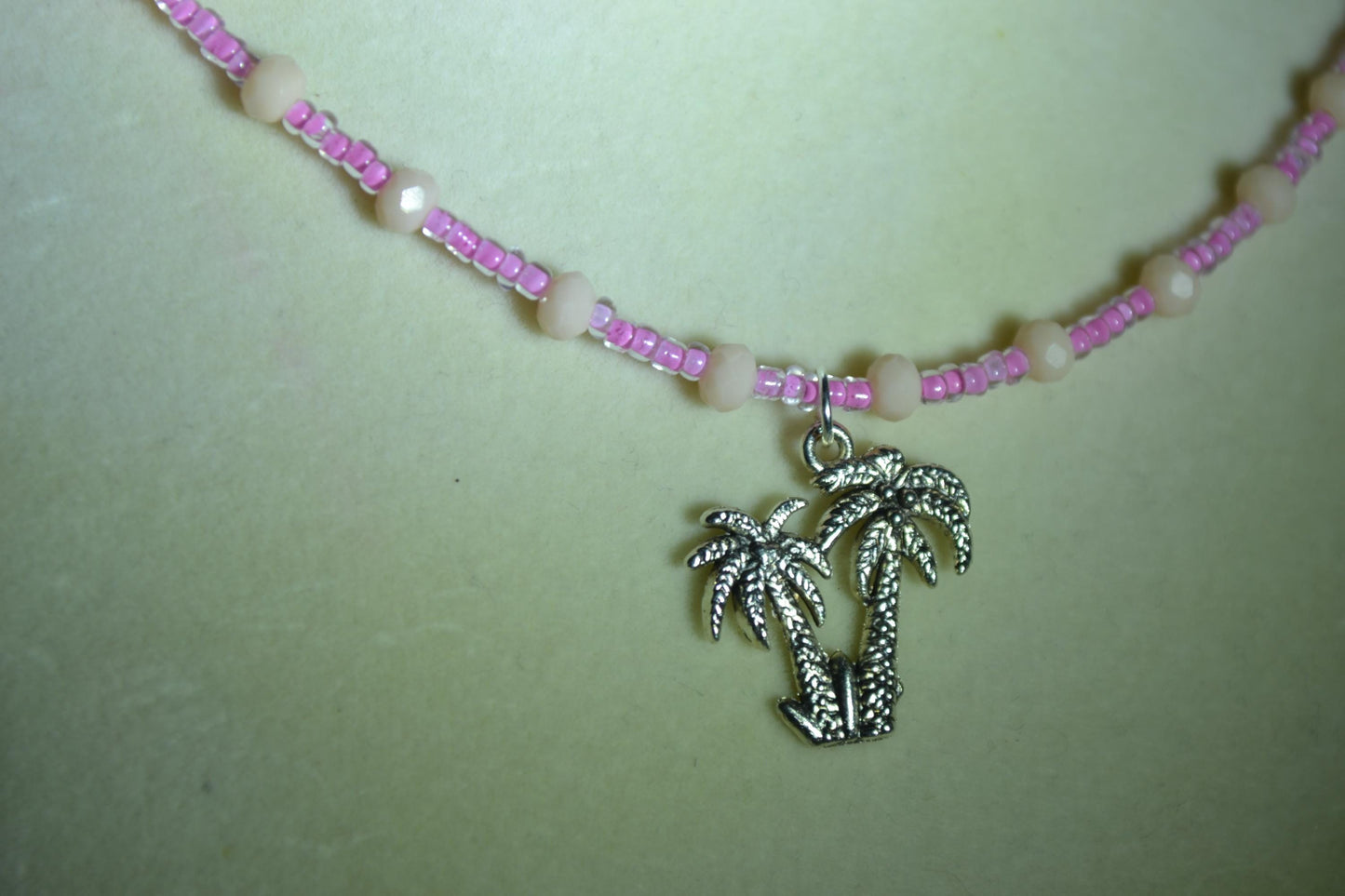 Palm Trees pendant glass bead necklace. Pink and cream