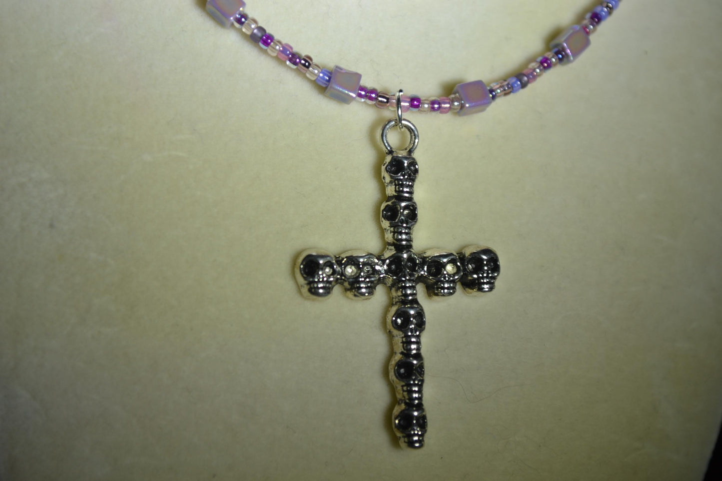 Skull Cross pendant glass bead necklace. Mixed purples