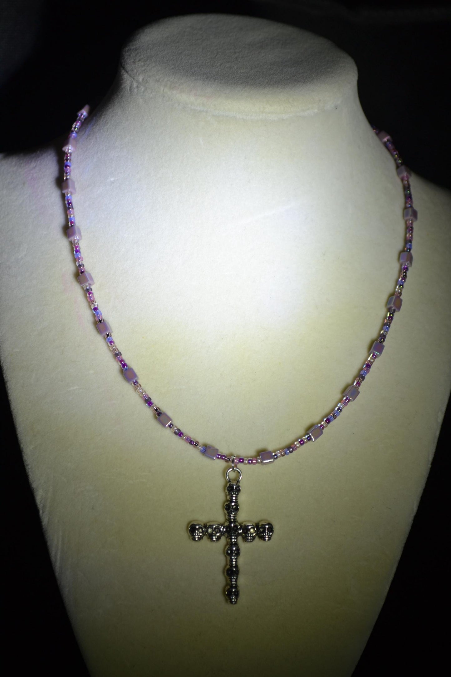 Skull Cross pendant glass bead necklace. Mixed purples