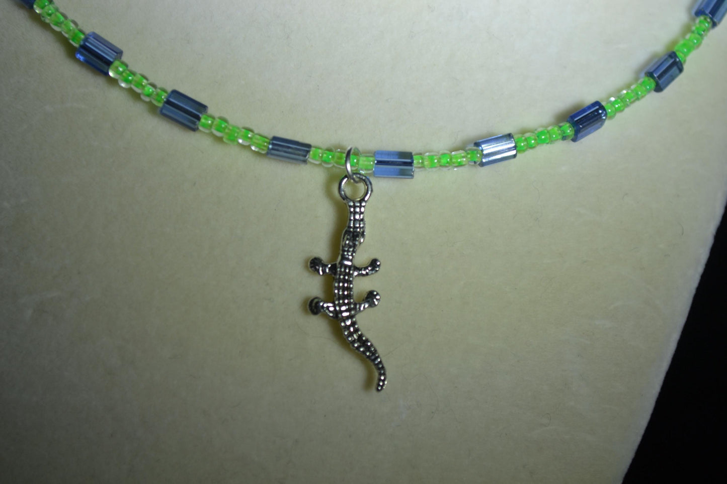 Alligator gecko pendant glass bead necklace. Blue and green
