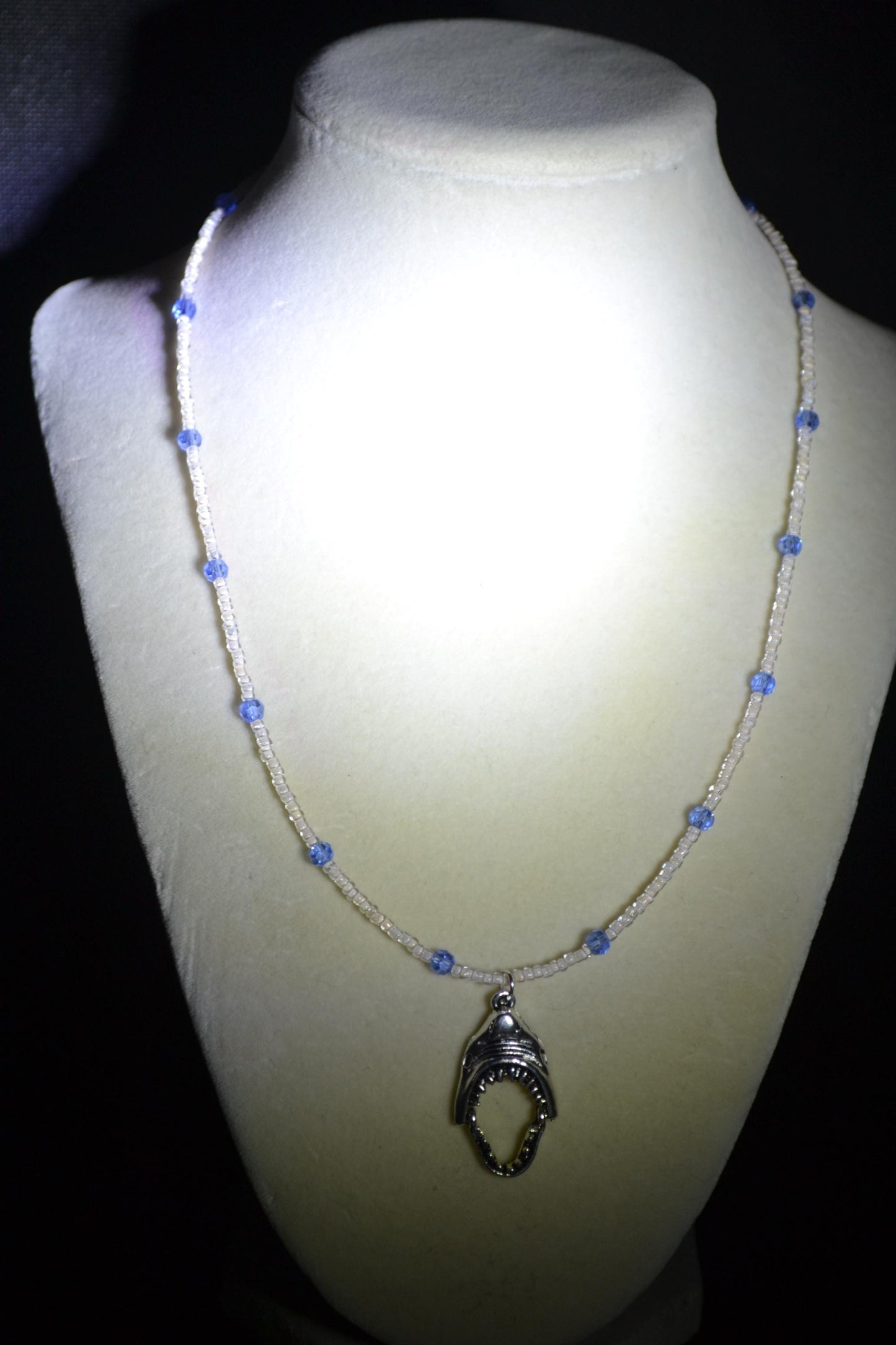 Shark jaws pendant glass bead necklace. Blue and white