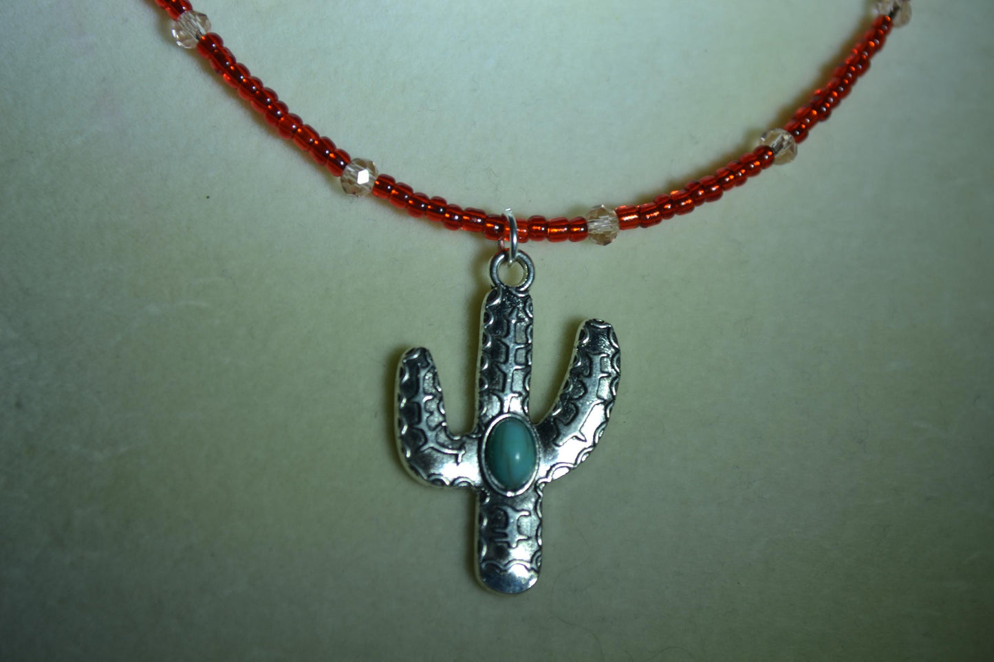 Turquoise Cactus pendant glass bead necklace. Red and rose