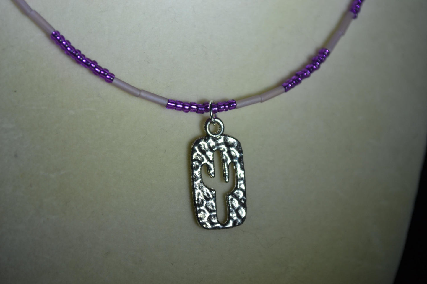 Hammered cactus pendant glass bead necklace. Purples