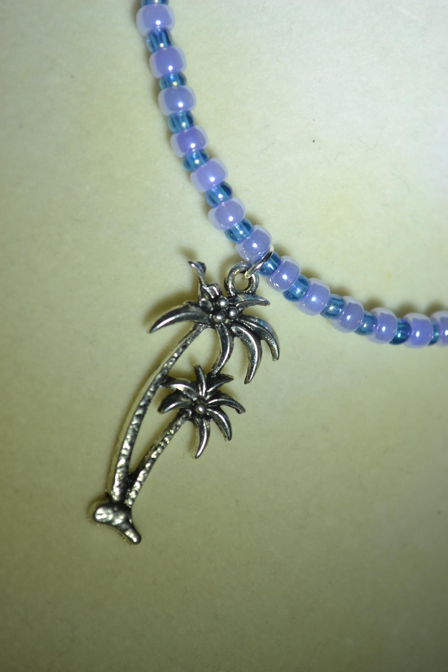 Palm Trees pendant glass bead necklace. Blue and lusty lavender
