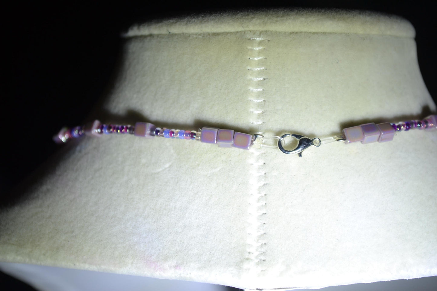 Skull Cross pendant glass bead necklace. Mixed purples