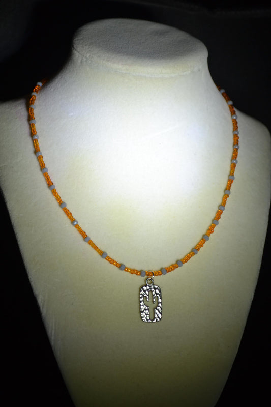 Hammered Cactus pendant glass bead necklace. Orange and grey