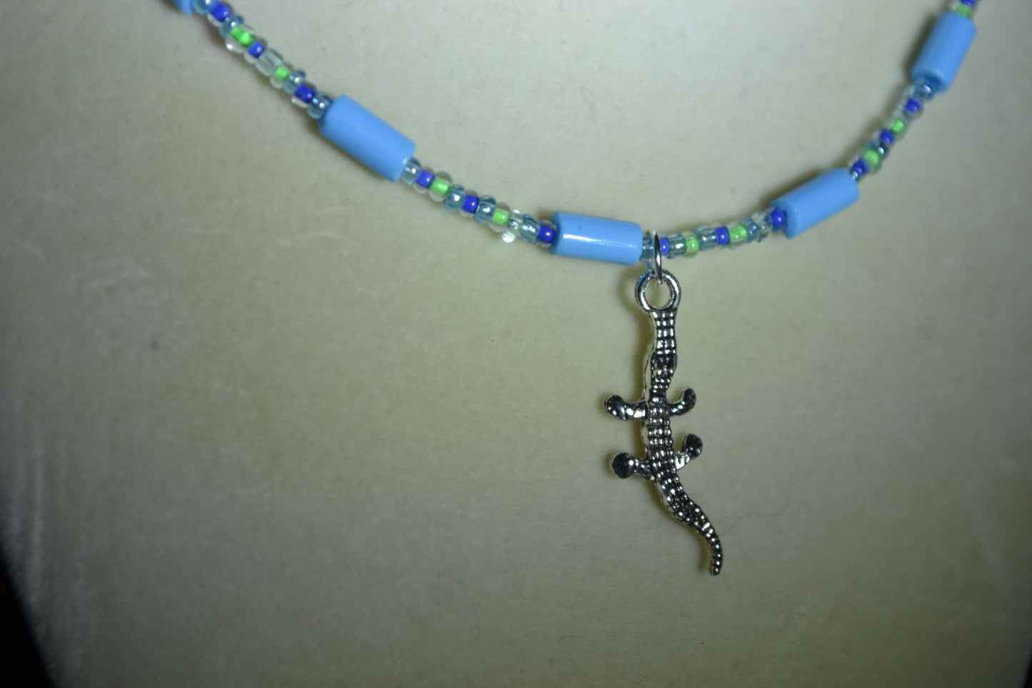 Alligator gecko pendant glass bead necklace. Blues and greens
