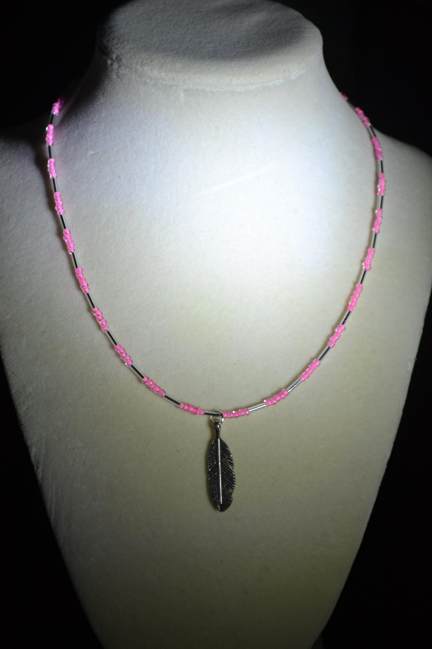Feather pendant glass bead necklace. Pink and silver