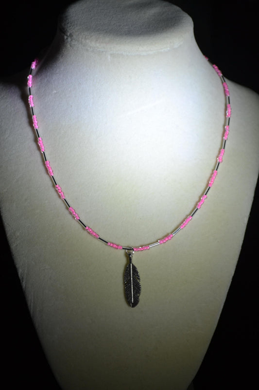 Feather pendant glass bead necklace. Pink and silver