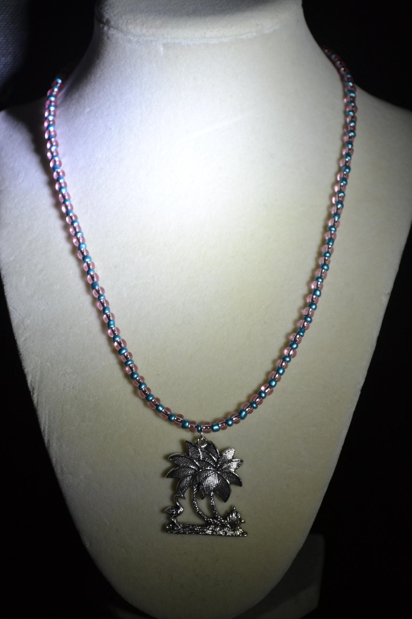 Palm Tree and Flamingo pendant glass bead necklace. Metallic blue and pink