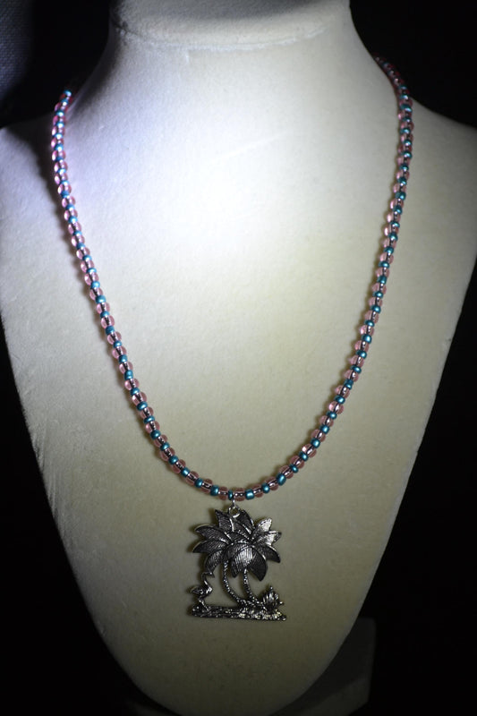 Palm Tree and Flamingo pendant glass bead necklace. Metallic blue and pink