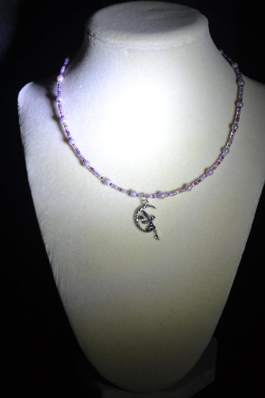 Fairy pendant glass bead necklace. Mixed purples