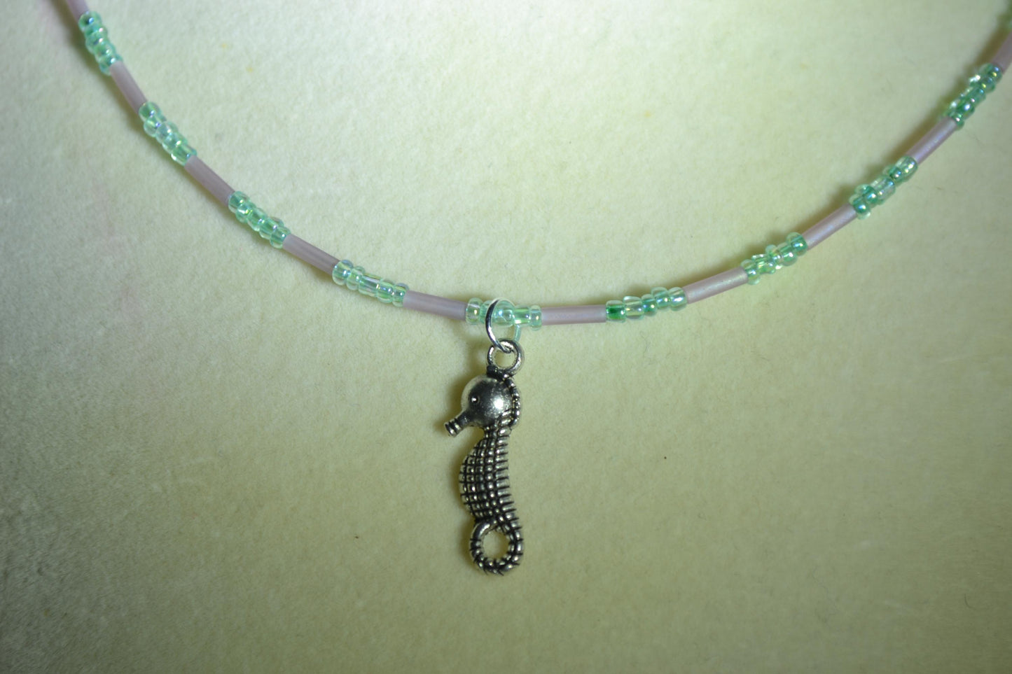 Seahorse pendant glass bead necklace. Blue and amethyst