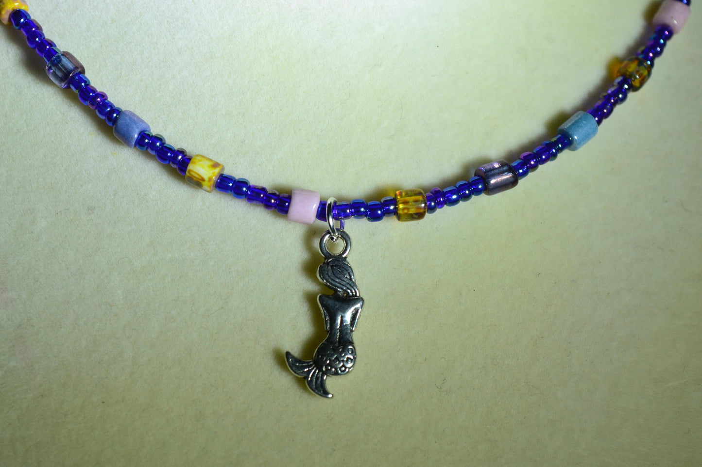Mermaid pendant glass bead choker. Blue and mixed natural colors