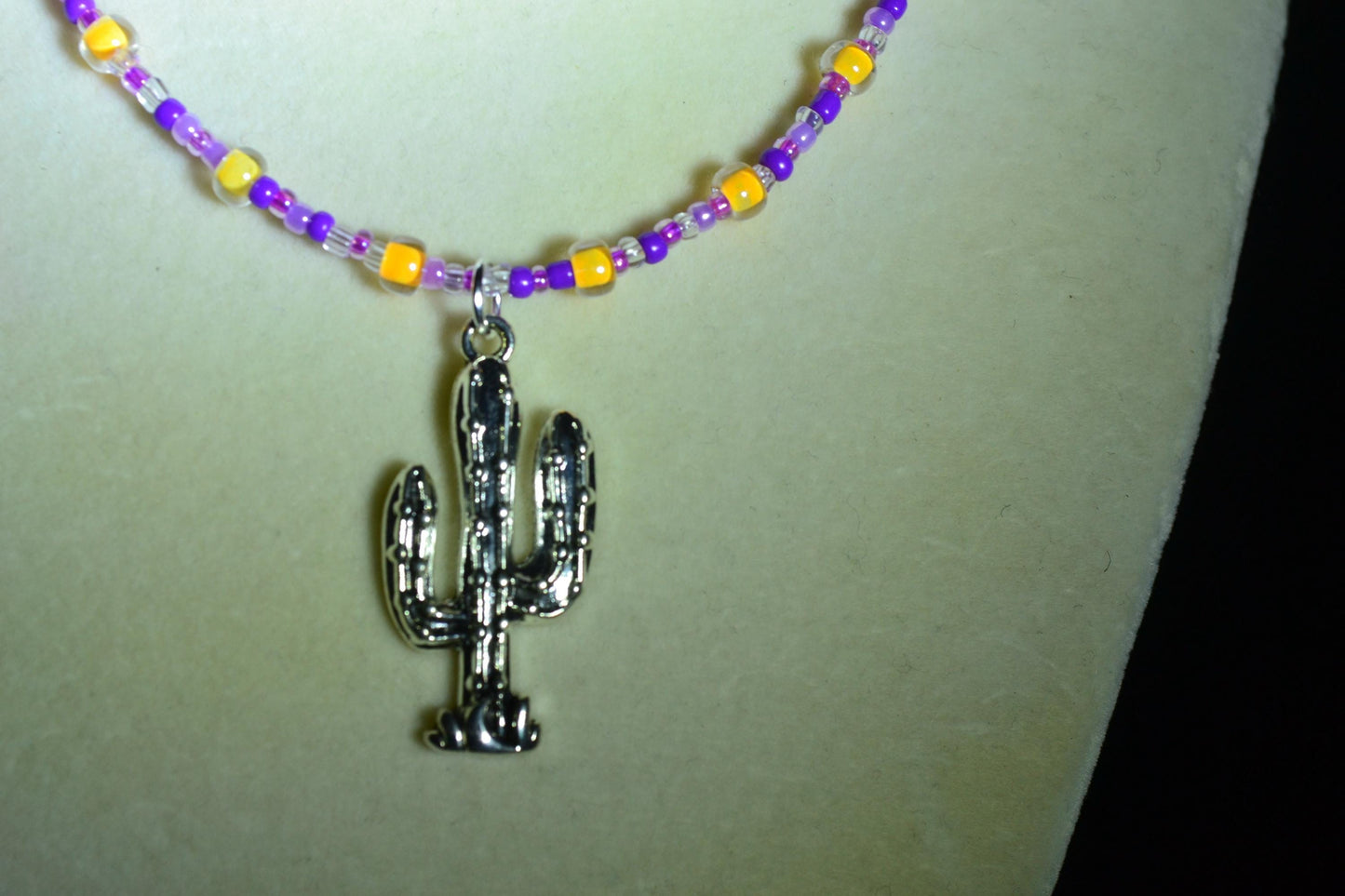Cactus pendant glass bead necklace. Purples and tangerine