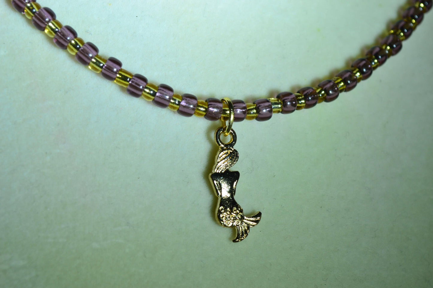 Mermaid pendant glass bead necklace. Amethyst and gold