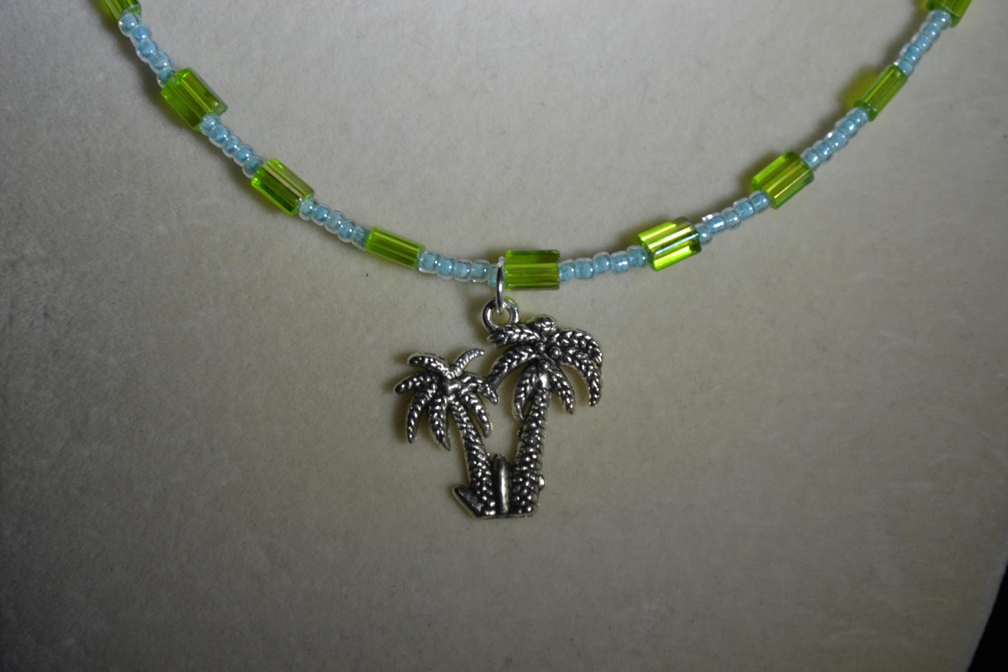 Palm trees pendant glass bead necklace. Blue and green