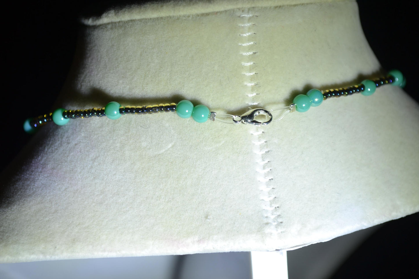 Jaguar pendant glass bead necklace. Teal and black