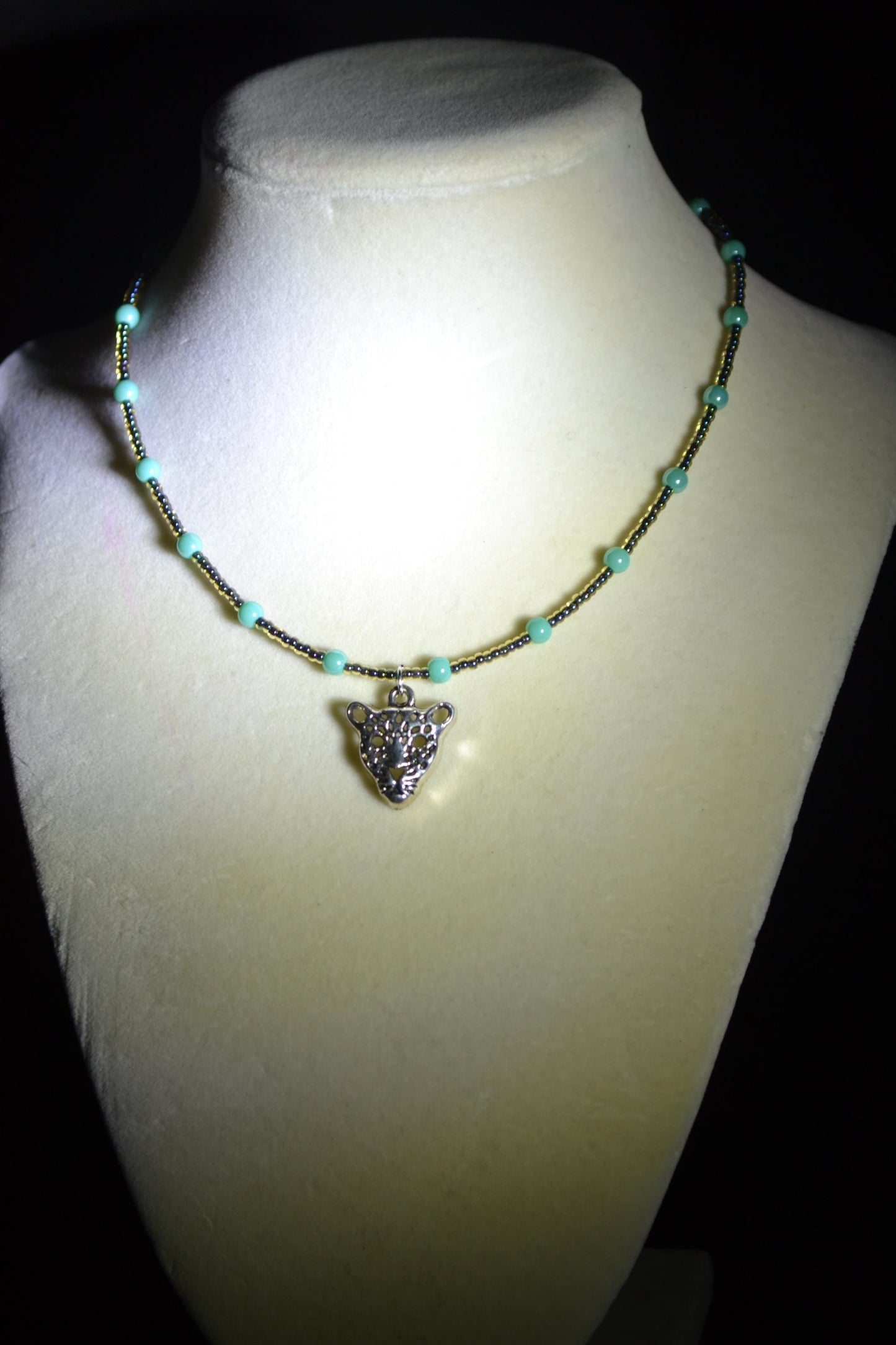 Jaguar pendant glass bead necklace. Teal and black