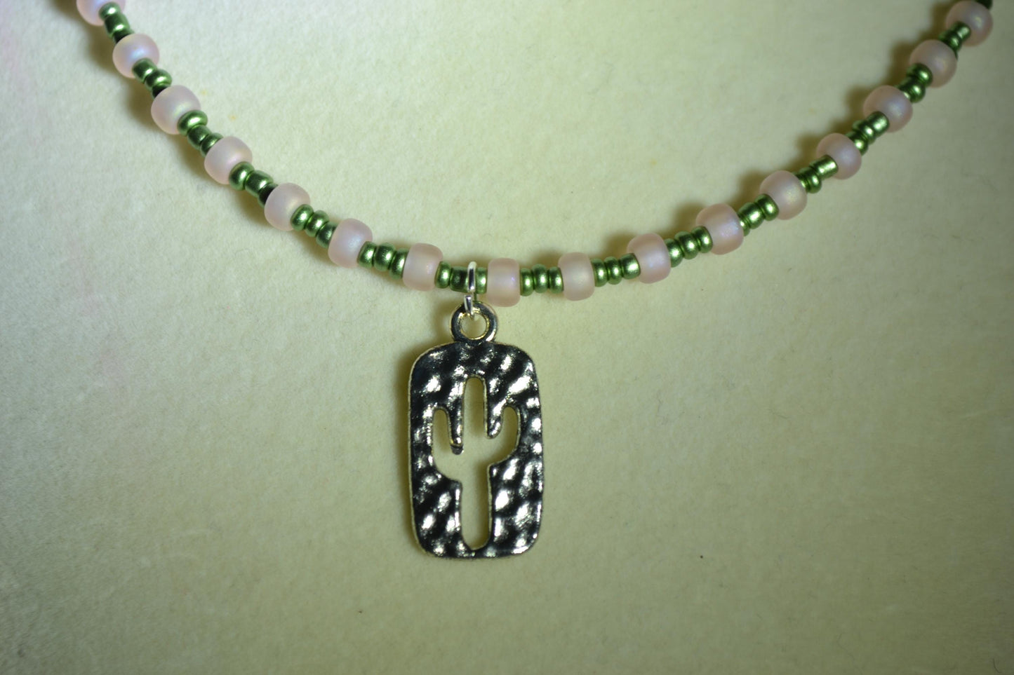Cactus pendant glass bead necklace. Metallic green and pink